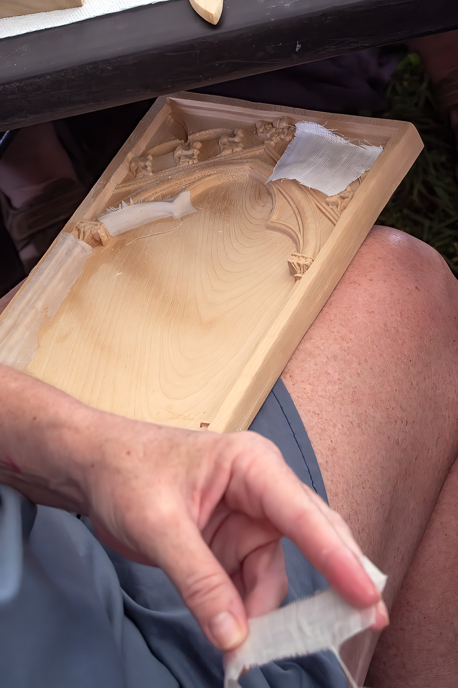 Pressing linen into the carved recesses